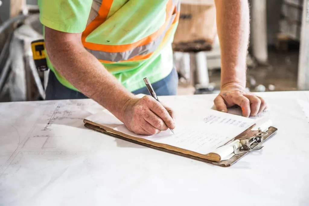 Roofing contractor preparing a quotation