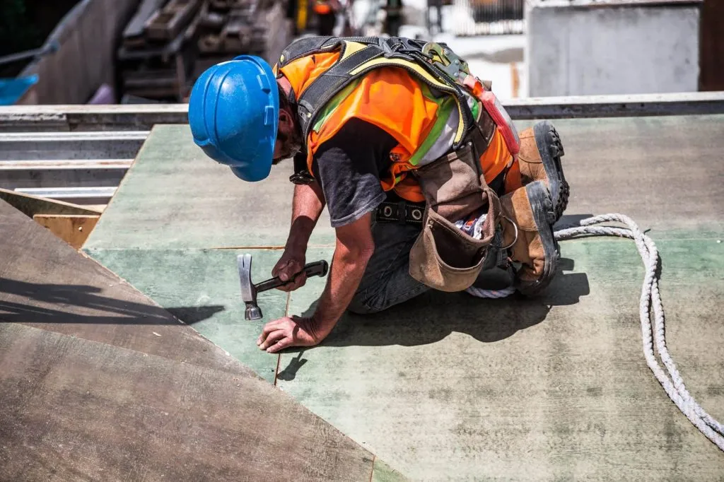 Roofer in full PPE on site