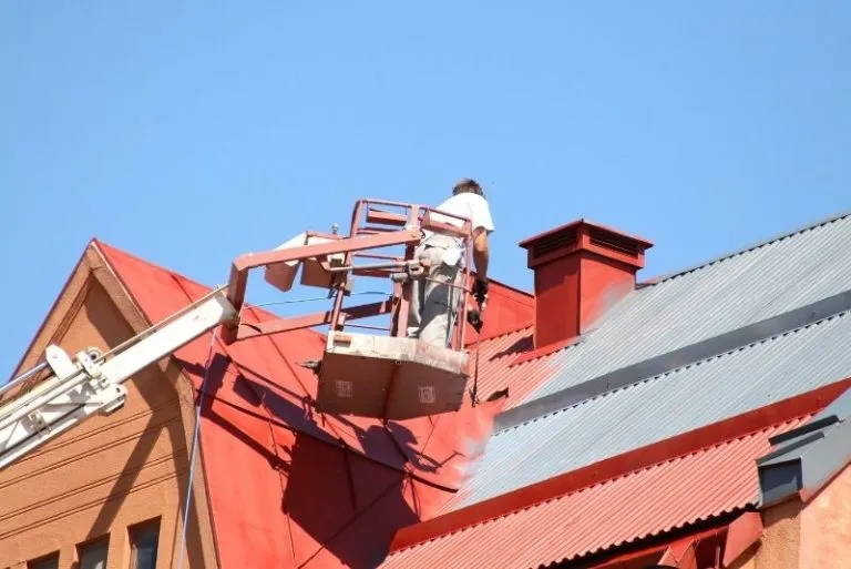 Roof coating builders at work